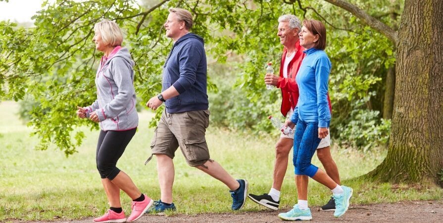 Alcohol and Antidepressants: Walking for Wellness Together Group walking outdoors, discussing alcohol and antidepressants recovery