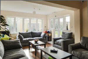 Alcohol Rehab Surrey: Welcoming Counselling Area Comfortable counseling room in Alcohol Rehab Surrey facility, sofas and natural light