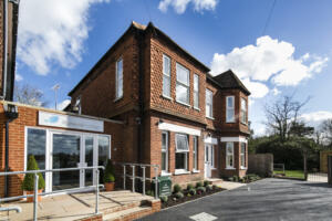 Alcohol Rehab Surrey: Effective Recovery in a Peaceful Setting Exterior of Alcohol Rehab Surrey facility with clear skies and greenery