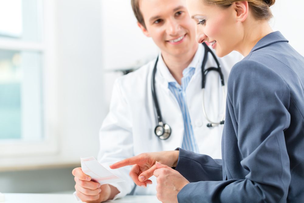 Doctor Consultation for Alcohol Addiction Recovery Doctor advising patient on alcohol rehab program