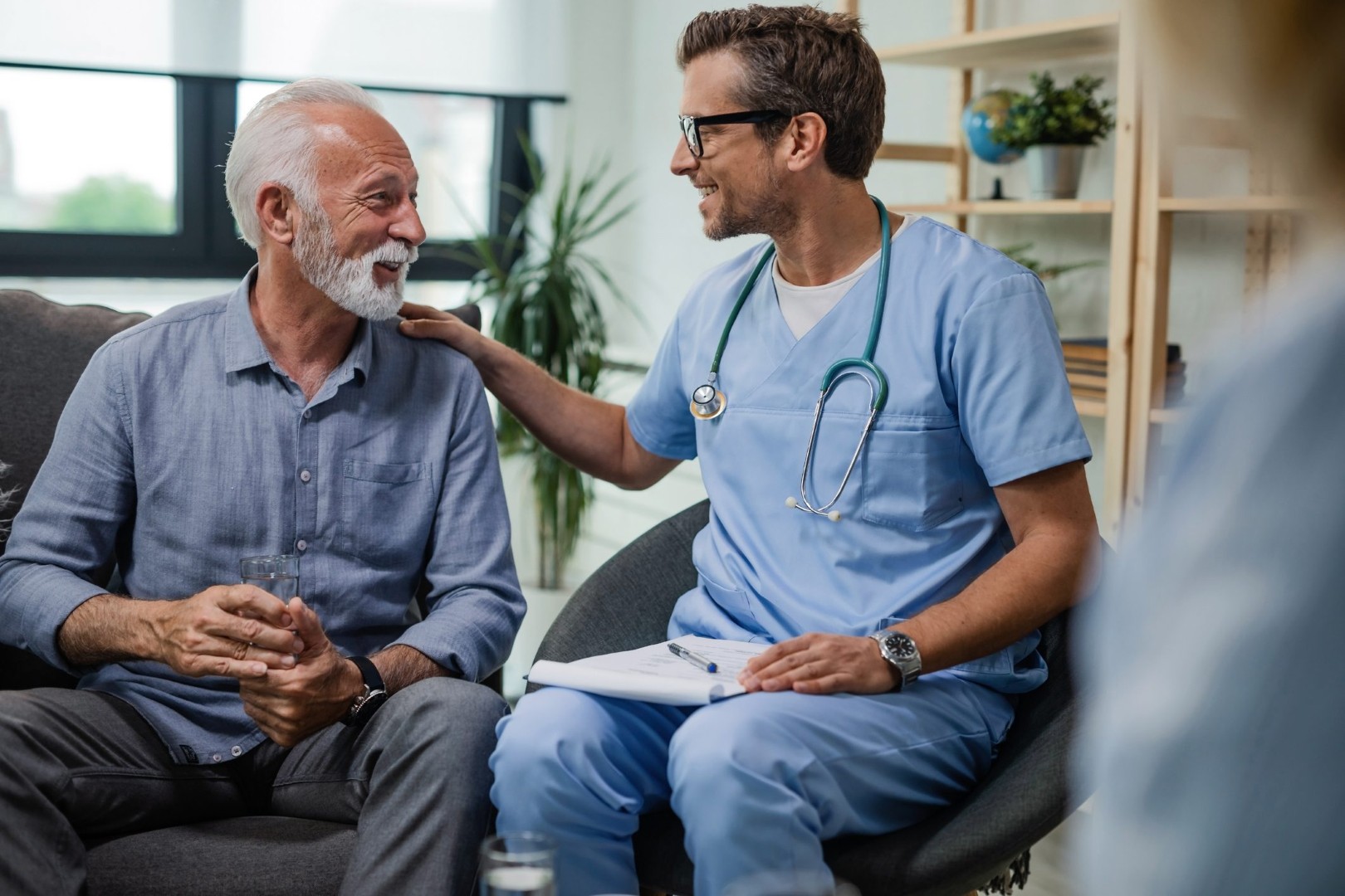 Doctor Supporting Patient in Alcohol Recovery Journey Healthcare professional encouraging man in alcohol rehab program