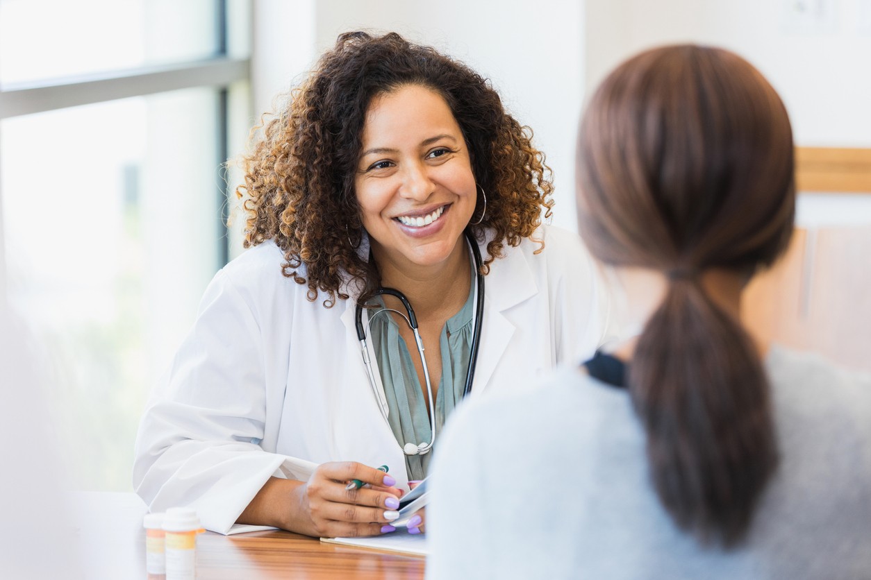 Female doctor offering counseling for alcohol rehab program