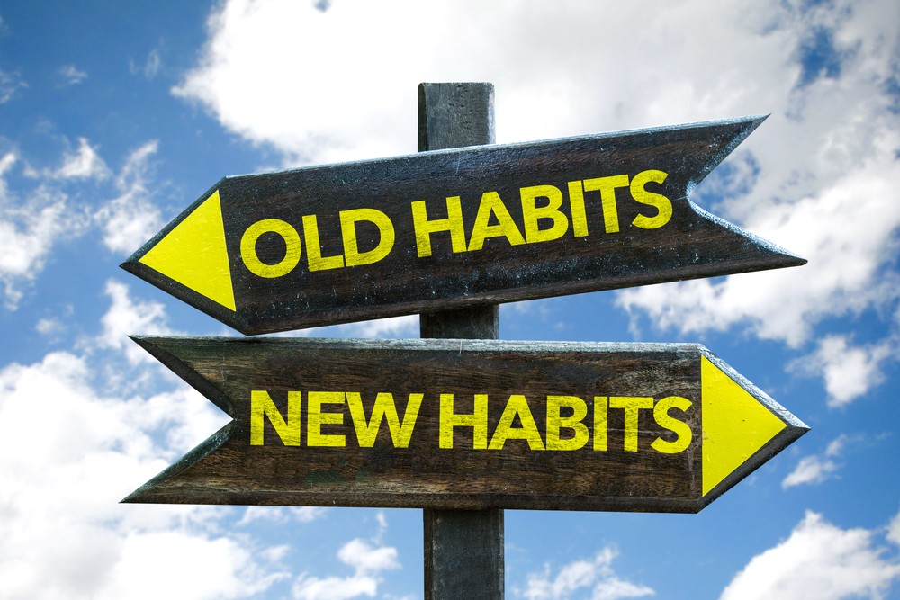 Is Alcoholism a Disease: Choosing New Habits for Recovery Signpost with "Old Habits" and "New Habits" exploring if alcoholism is a disease