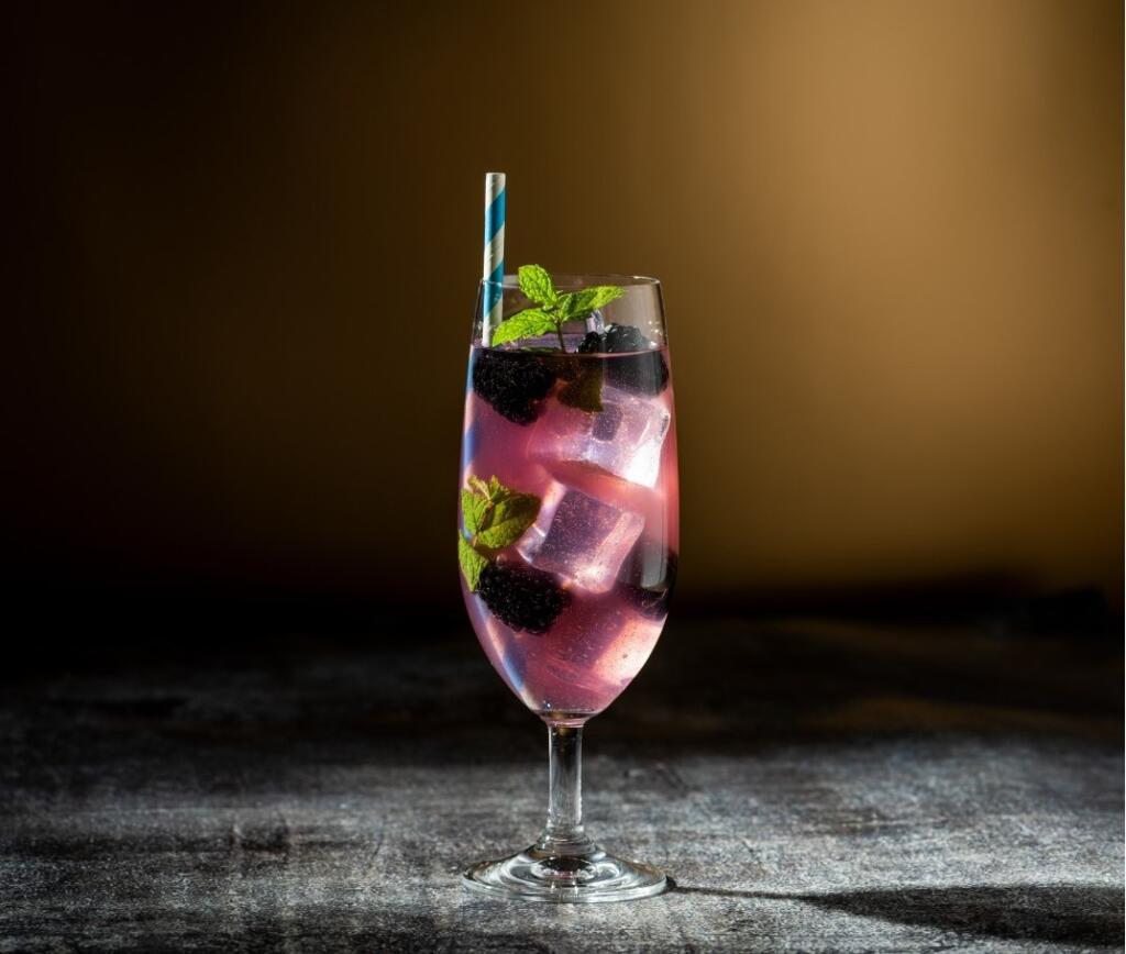 Non Alcoholic Beer: Enjoyment in Sobriety Glass of non alcoholic beer with berries and mint for an alcohol-free lifestyle