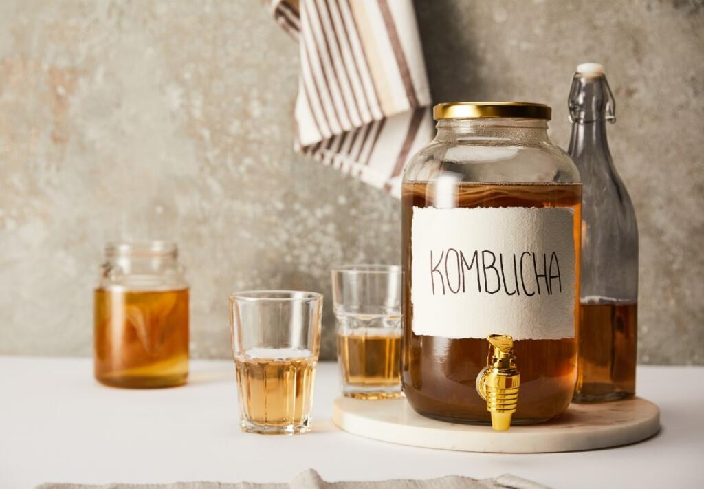 Non Alcoholic Beer: Kombucha as a Healthy Alternative Kombucha with drinking glasses, a non alcoholic beer option for recovery