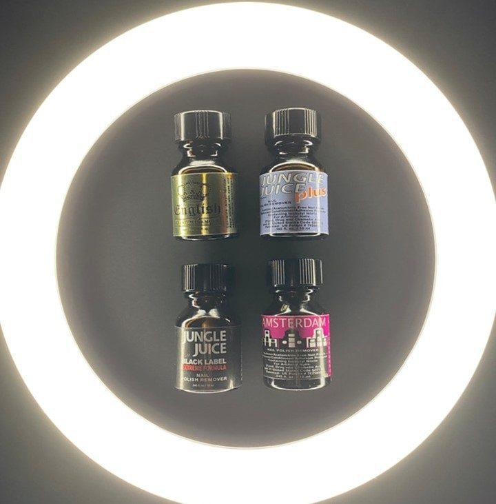 Bottles of poppers arranged in a circle, highlighting the risks