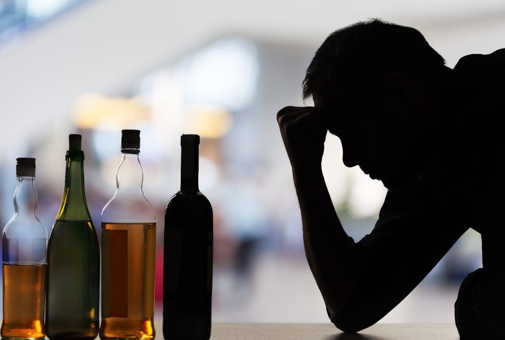 Rehab Dubai: Overcoming Alcohol Challenges Silhouette of man struggling with alcohol, rehab Dubai support