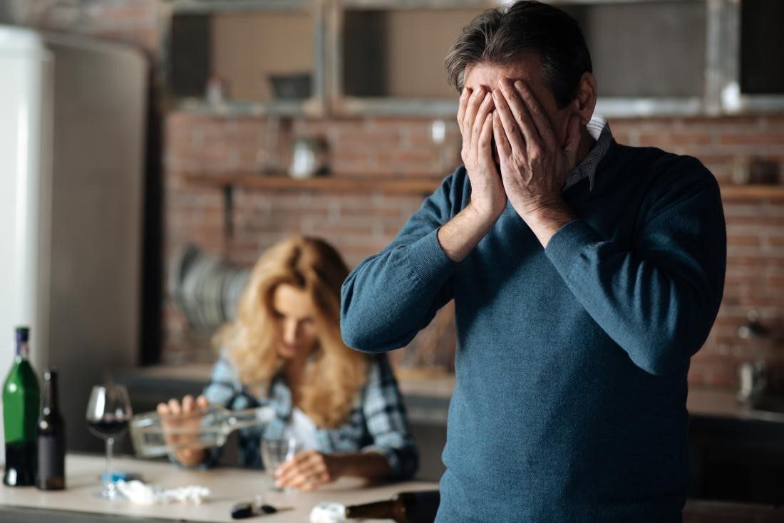 Understanding the Signs of Alcohol Dependence Distressed man and woman indicating signs of alcohol dependence