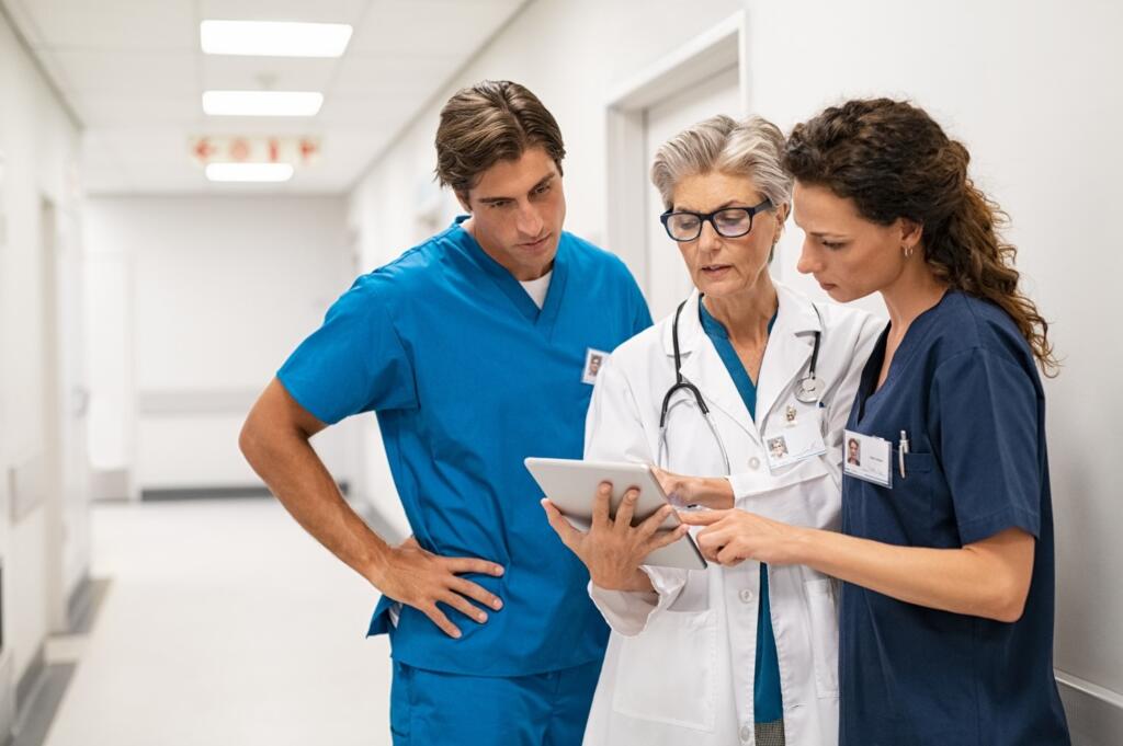 Understanding What is Ethanol: Addiction Recovery Insights Three healthcare professionals discussing what is ethanol in rehab