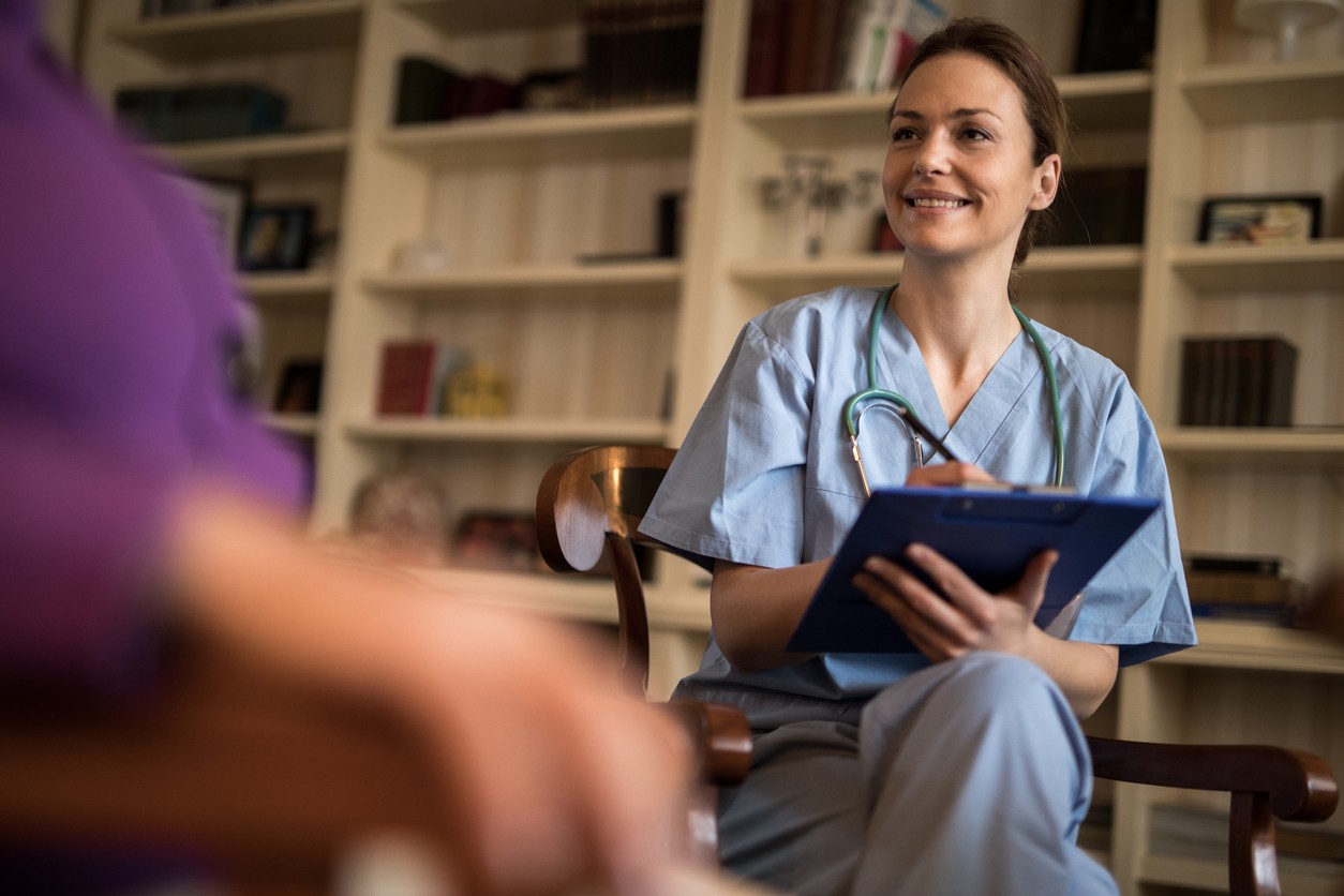 Nurse smiling in therapy session, supporting alcohol rehab program in Kent, England